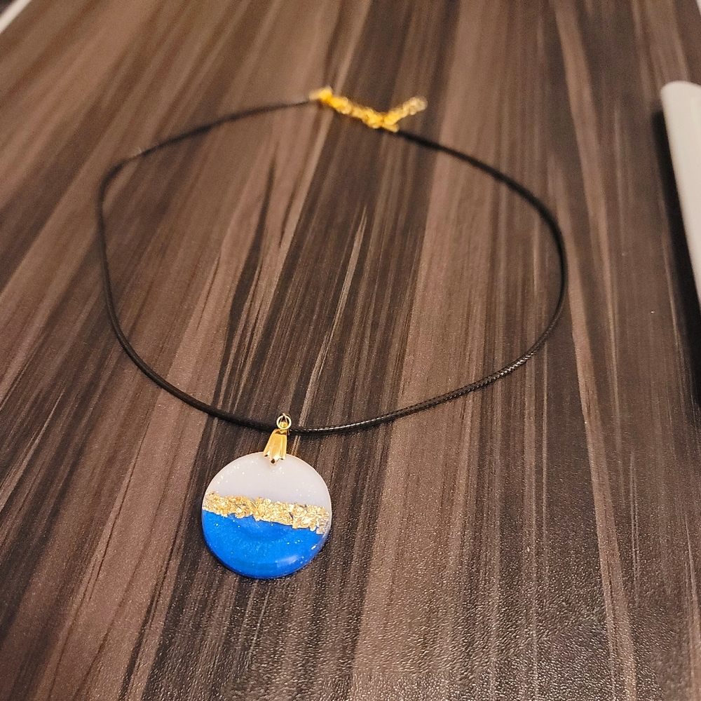 Handmade necklace, resin pendant, white and blue with gold flakes